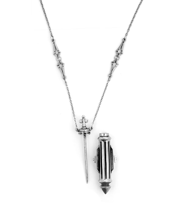 Silver necklace with a cylindrical pendant on a white background