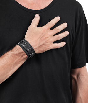 men's with hand on his chest wearing jan hilmer square ring leather cuff