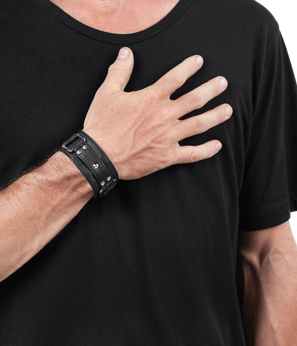 men's with hand on his chest wearing jan hilmer square ring leather cuff