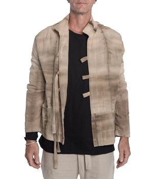 Kimono style jacket crafted from 100% plant dyed cotton, 3 front-tie fastening and 2 front pockets.