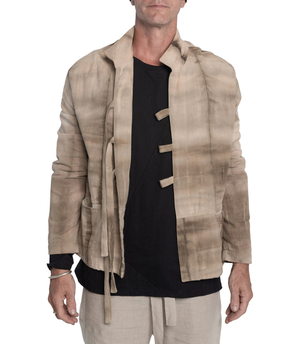 Kimono style jacket crafted from 100% plant dyed cotton, 3 front-tie fastening and 2 front pockets.
