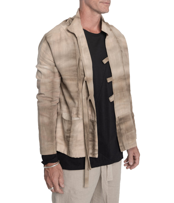 Kimono style jacket crafted from 100% plant dyed cotton, 3 front-tie fastening and 2 front pockets.