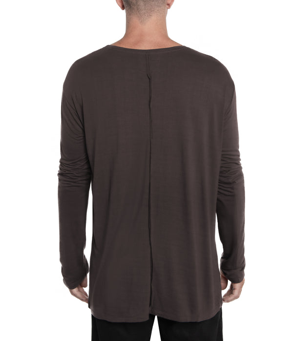 Relax fit long sleeve men's shirt crafted from light weight bamboo-cotton blend. With 2 asymmetrical seam lines on its front, and 1 vertical seam running down its back this men's shirt is simple yet unique and original.