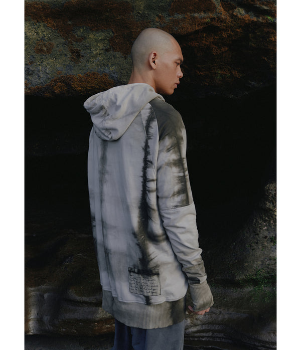 Drawstring hoodie sweatshirt crafted from medium weight cotton terry finished with ecovero* ribbing, lined hood. Hand dyed with plant with shibori method.