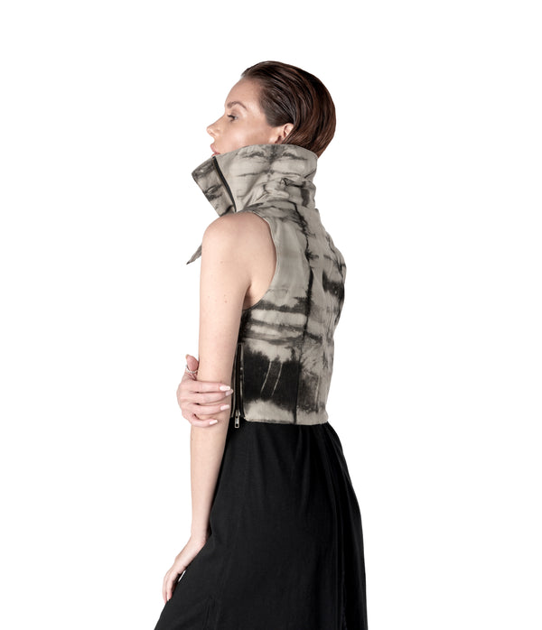 plant dyed cropped women sleeveless vest with high flared collar. Zippers along waist line. Hand cast snake claw front zipper pull.