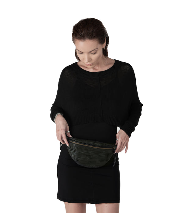 Compact, adjustable leather waist bag designed to carry a wallet, an iphone, a few miscellaneous items and some keys.